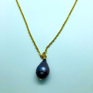 Black pearl on plated gold necklace.